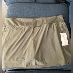 NWT Athleta Soho Skirt. Pockets front and back. Olive type in color. Size 24.